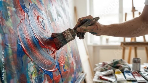Artistically Driven Painting Creating Dynamic Color Waves in Bright Studio