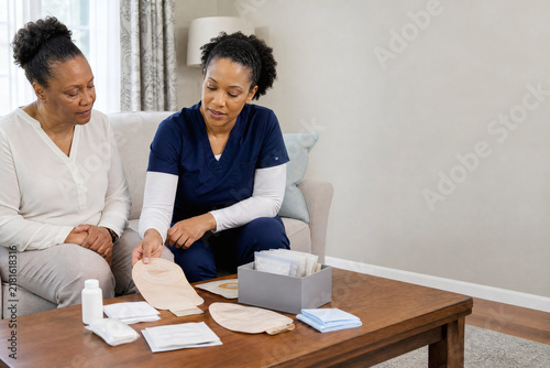 Ostomy Care Education with Healthcare Professional and Patient at Home