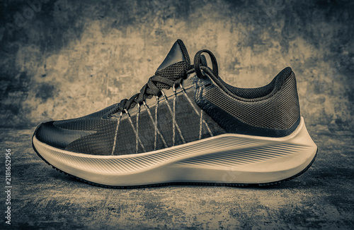 Sport shoes on grunge background with filter effect retro vintage style.