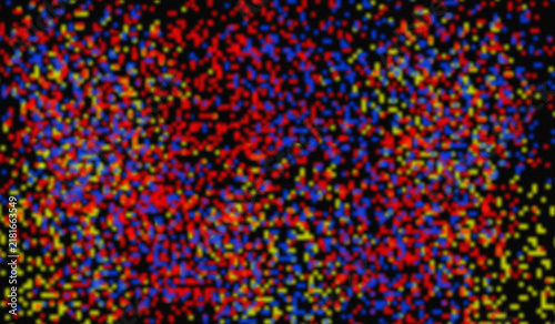 Abstract Colorful Pixelated Noise Texture Background with Red Blue and Yellow Dots
