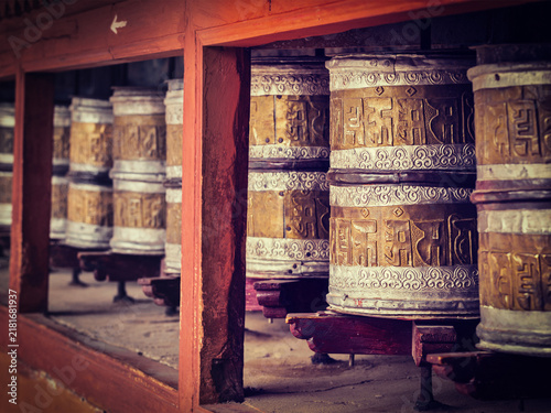 Bild auf Leinwand Vintage retro effect filtered hipster style view of Buddhist prayer wheels in Hemis gompa (Tibetan buddhist monstery)