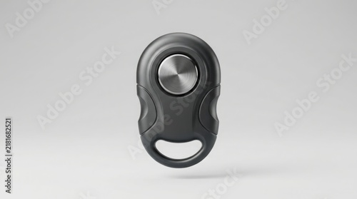 Smart tracker device featuring a brushed metallic silver button and dark grey matte housing rests on a clean light grey gradient background.