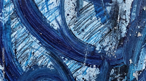 Dynamic abstract artwork featuring expressive blue and navy brush strokes, textured paint splashes, and layered artistic patterns