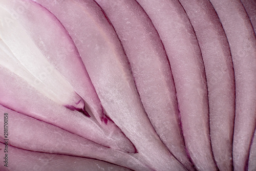 A close-up view of the texture of a red onion when cut. Onion macro photography.