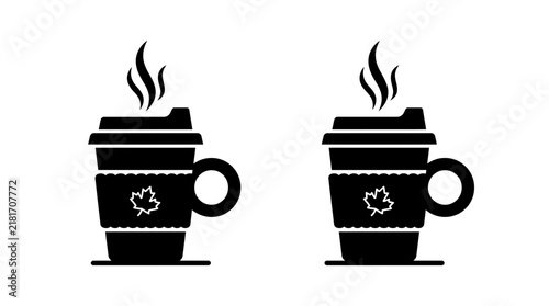 Steaming takeaway coffee cups with maple leaf design.