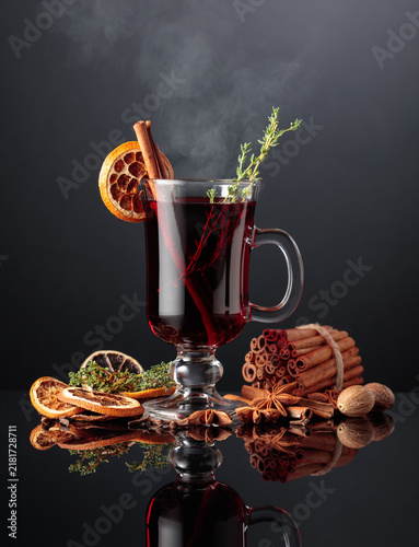 Obraz na płótnie Mulled wine with spices on a black background.