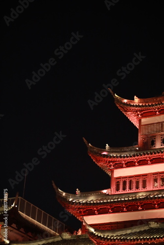 Bild auf Leinwand Ornate Chinese Pagoda Roofline Illuminated at Night