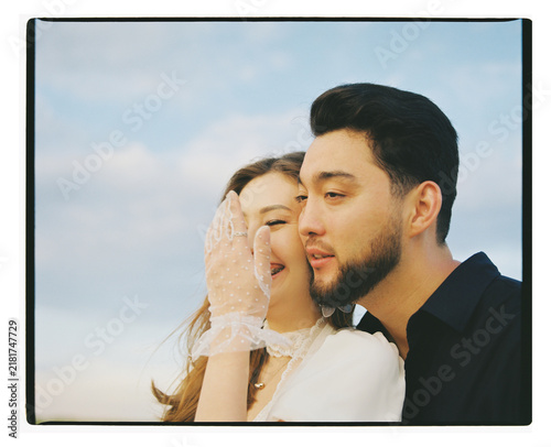 Young Couple Laughing Together in Close-up Portrait