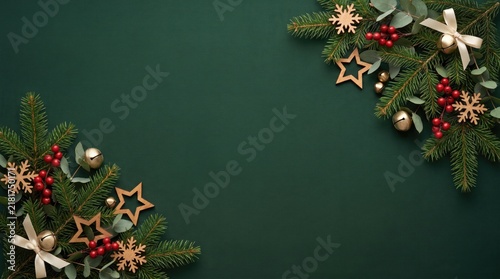 Festive christmas background with pine branches and decorations on dark green
