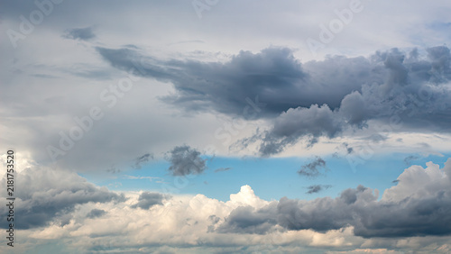 Dramatic Storm Clouds Gathering Over Blue Sky. 16-9 Panoramic Weather Background