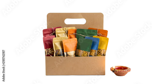 Kraft paper carrier box filled with assorted colorful snack pouches and a small clay oil lamp