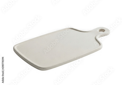 A sleek white cutting board with a built-in handle for easy gripping and serving.