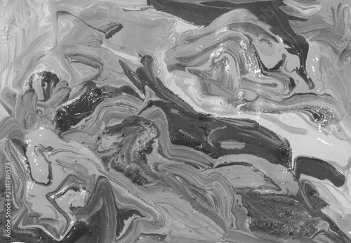 Abstract black and white marbled paint texture with flowing organic swirls, layered tones, expressive fluid patterns, and realistic artistic details. Monochrome decorative background suitable.