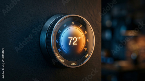 Modern smart home thermostat interface | Digital temperature control panel on wall | Energy efficient HVAC home automation system | Sleek round smart thermostat displaying 72 degrees