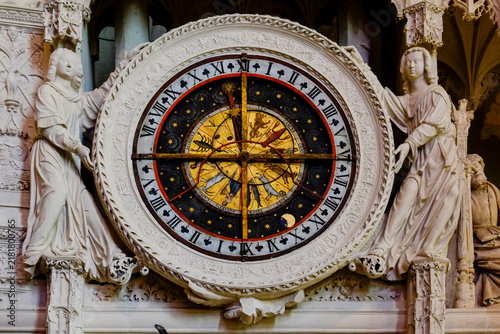 Ornate astronomical clock face on a cathedral facade