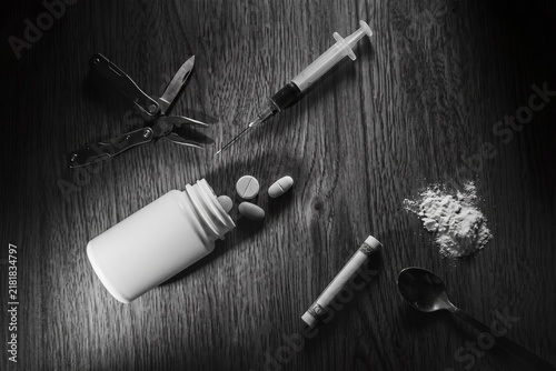 Drug Use Elements with Syringe and Pills in Black and White