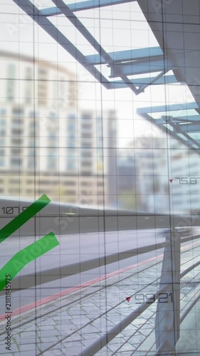 Animation of graphs, time lapse of moving vehicles on street against modern buildings