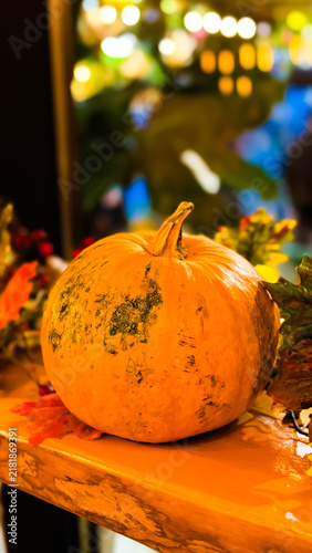 Festive autumn pumpkin on counter