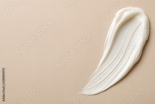 White Skincare Cream Swatch on Warm Beige Background with Copy Space