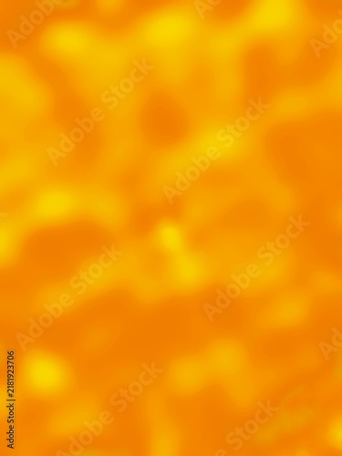Abstract out of focus blurred background in vibrant warm orange and yellow tones with soft light bokeh effects