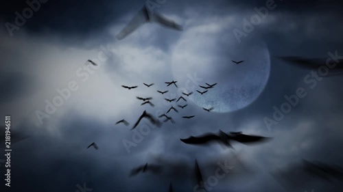 Bats Flying out of a Cloud Covered Moon 4K Loop features illustrated bat silhouettes flying forward out of a sky with a full moon and moving clouds in a loop.