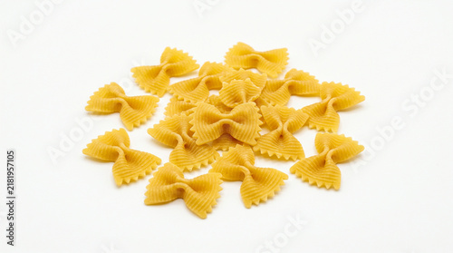 Raw farfalle bow-tie pasta isolated on white background for culinary food photography
