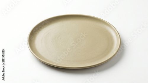 Oval ceramic plate isolated on white background for food presentation