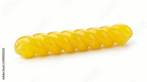 Close-up of yellow spiral candy on white background for confectionery marketing