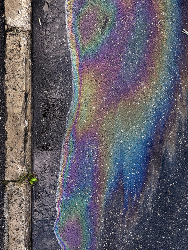 Rainbow oil slick asphalt texture
