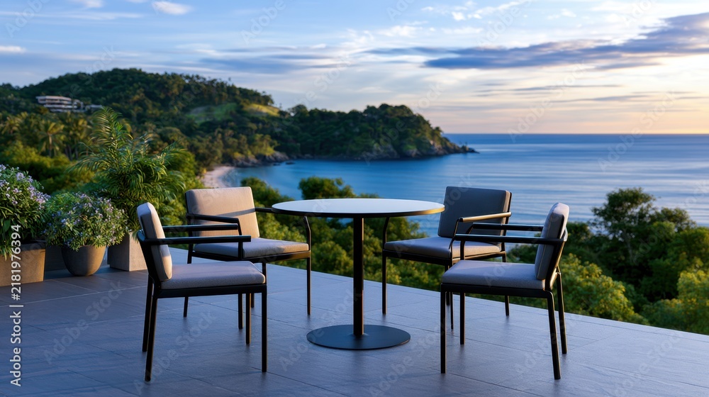 Fototapeta premium A serene outdoor patio scene showcases a table and chairs overlooking a coastal landscape at dusk