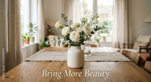 Elegant White Flower Arrangement in a Ceramic Vase on a Wooden Table