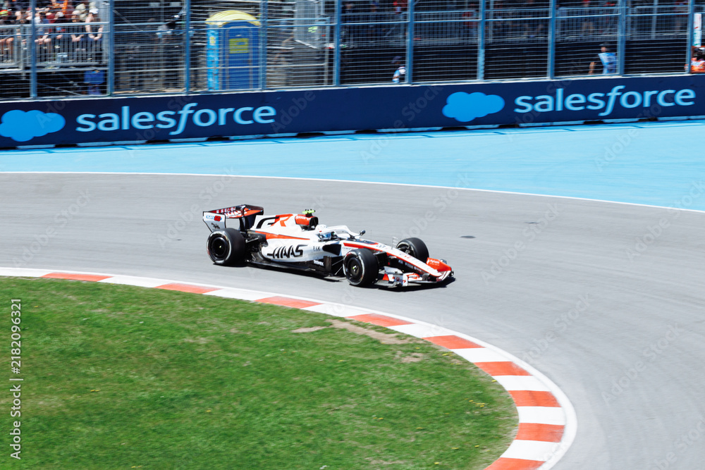 Obraz premium May 24, 2026, Montreal, Canada, Esteban Ocon races a Haas F1 car at Circuit Gilles-Villeneuve. g.