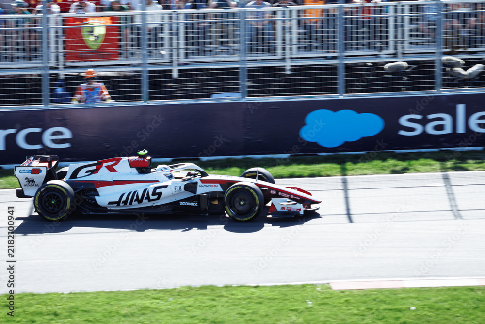 Obraz premium May 24, 2026, Montreal, Canada, Esteban Ocon races a Haas F1 car at Circuit Gilles-Villeneuve. g.