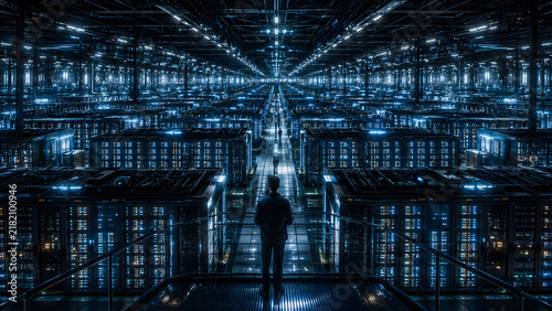 Obraz na płótnie Technician overlooking a vast futuristic data center