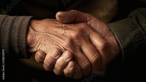 Two Old Friends Shaking Hands in Close up