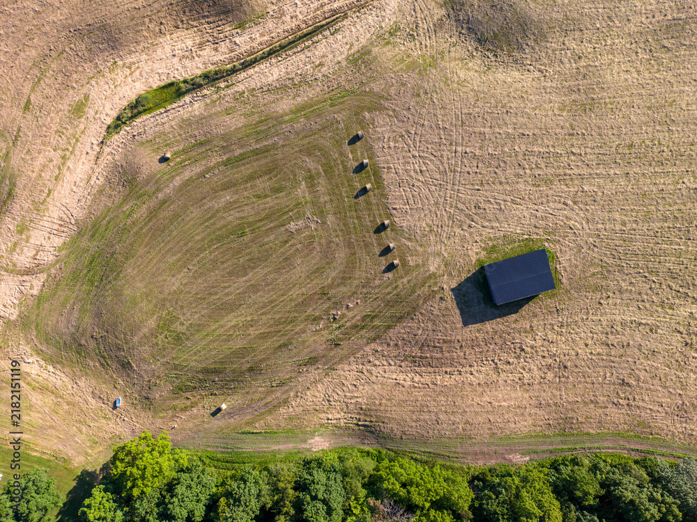 Fototapeta premium Harvested Farm Field With Hay Bales in Ontario