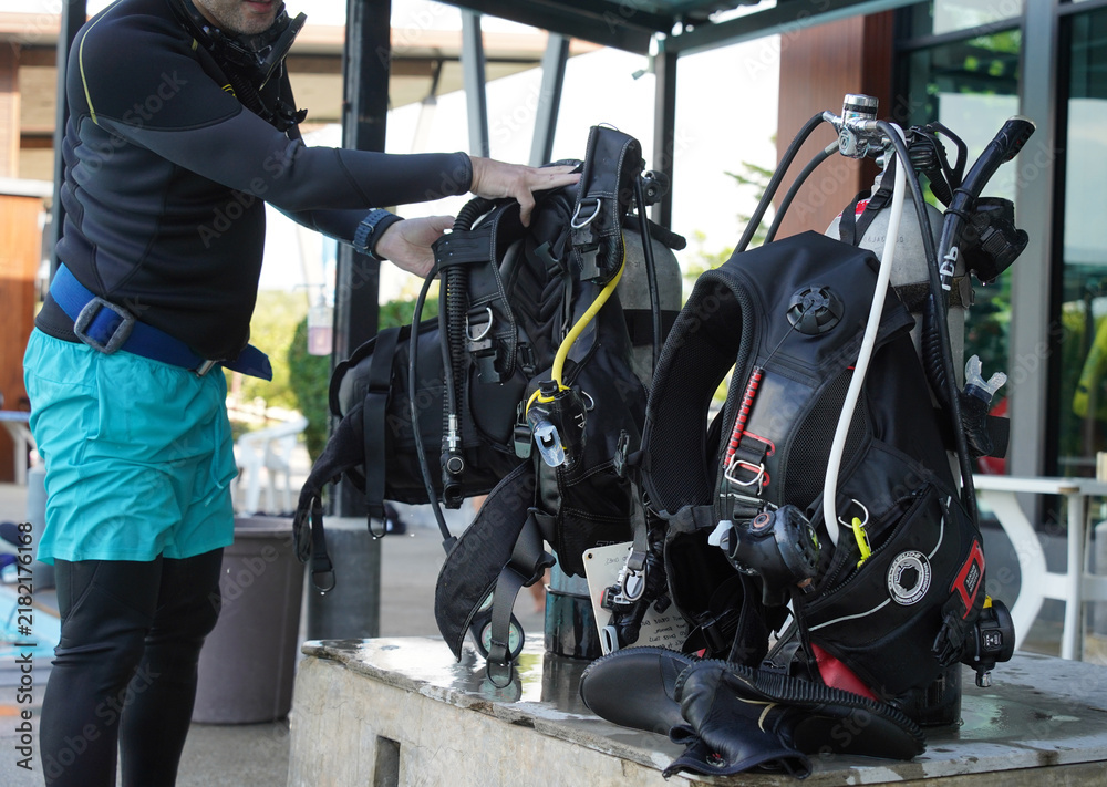 Fototapeta premium Scuba diving equipment with oxygen tank near swimming pool