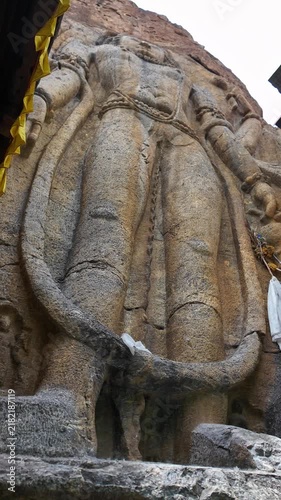 Ladakh, India : Panoramic footage of massive Buddha rock cut statue in Mulbekh Gompa, historic Buddhist monastery along Kargil - Leh highway of Ladakh, India