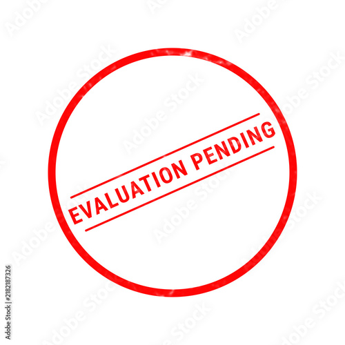 Fotografie A bright red circular rubber stamp graphic featuring the words evaluation pendin