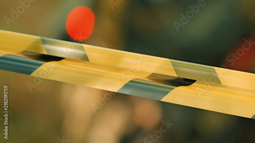Canvastavla Close up of yellow black striped caution tape stretched across frame, shallow de