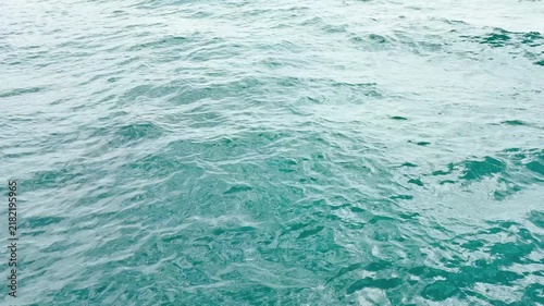 Turquoise ripple water reflection in tropical beach. Blue ocean waves. Summer sea. Waves in motion