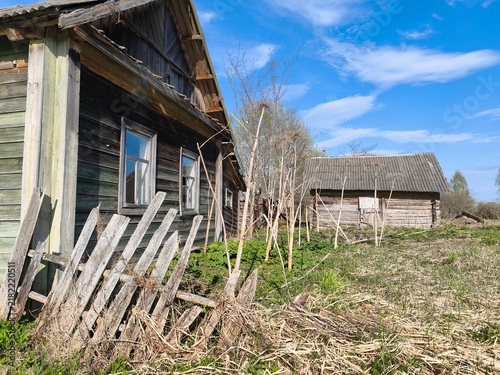 Old abandoned wooden logs houses in a remote traditional Russian village