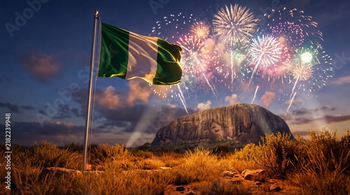 Waving Nigerian flag in foreground with Zuma Rock landmark and colorful celebratory fireworks at night