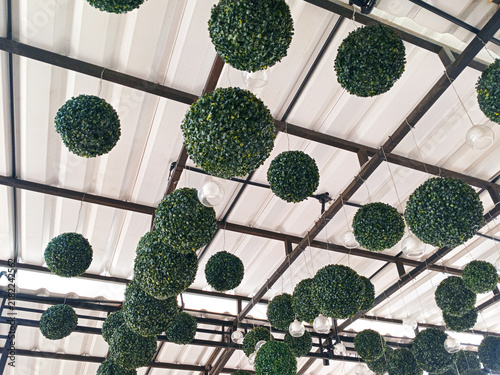 Hanging green topiary artificial grass decorative balls on ceiling