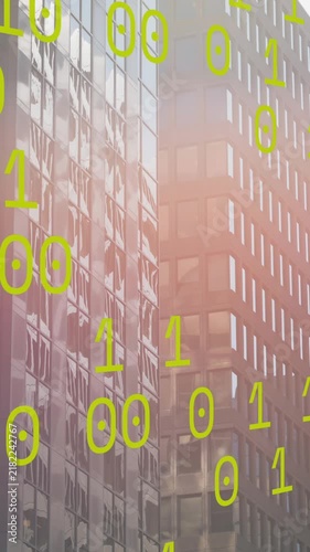 Animation of binary coding data processing against tall buildings