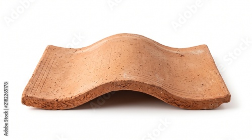 Single curved clay roof tile isolated on white background for construction and renovation