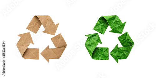 Принти на полотні Brown kraft paper and green crumpled paper recycling symbols with folded arrows,