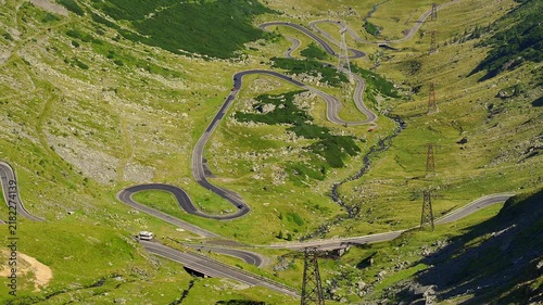 Hairpin bends of the Transfagarasan mountain road crossing a dramatic valley in Romania