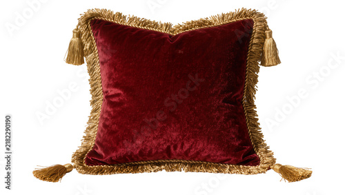 Fotografie Plush deep red velvet cushion with ornate gold fringe and tassels, isolated on t