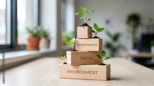 Conceptual image of ESG sustainability pillars represented by stacked wooden blocks labeled Environment Social and Governance, small green plant sprouts growing from soil on each